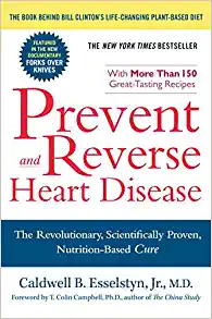 A book cover with the title of prevent and reverse heart disease.